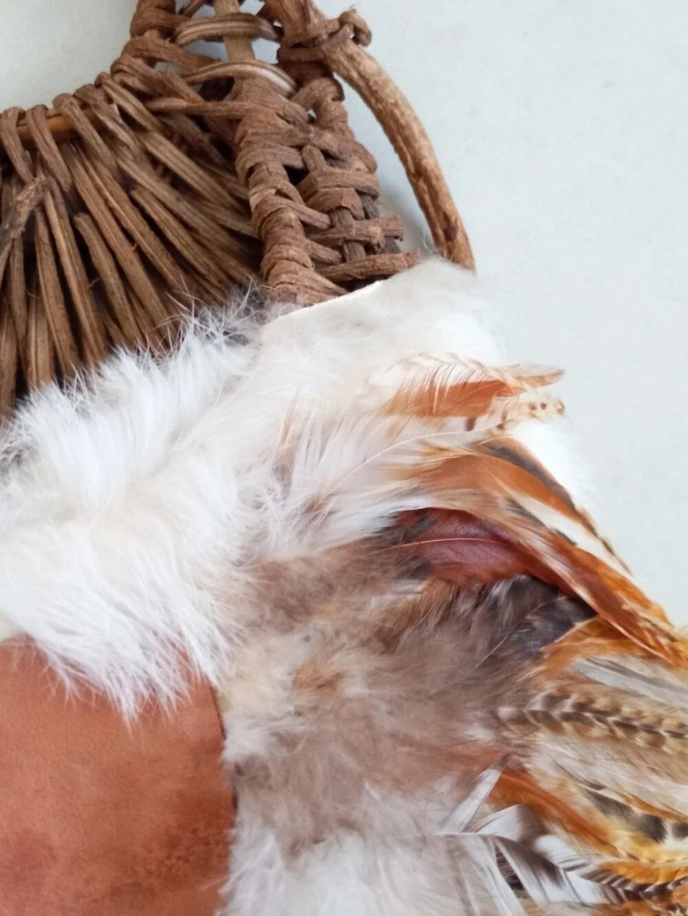 Indigenous Native American vintage natural wicker and feather wall basket